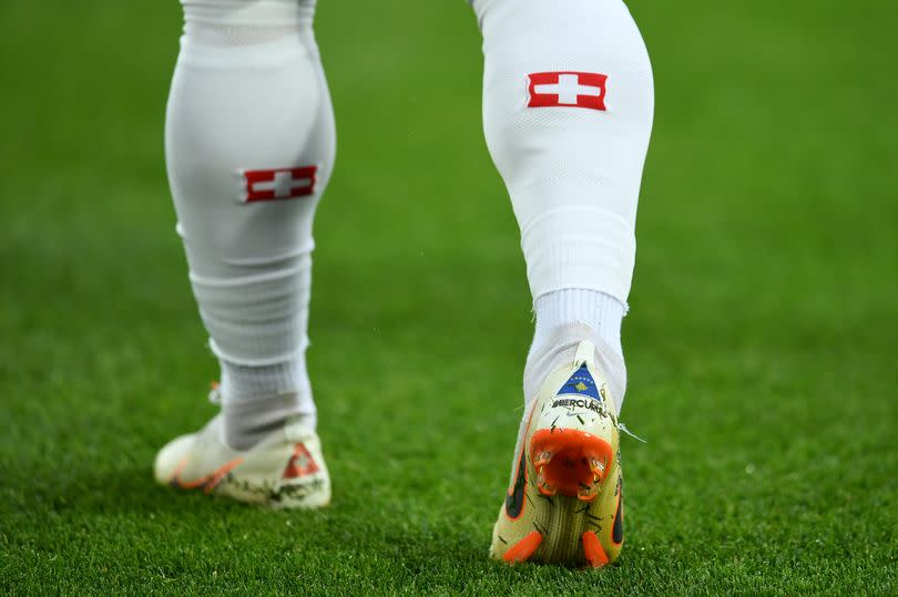 The Swiss and Kosovo flags are stitched into the heels of Xherdan Shaqiri's boots for the   World Cup match between Serbia and the Swiss in Kaliningrad.