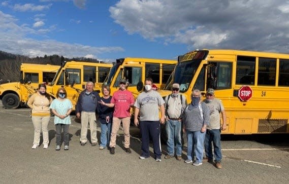 Mars Hill Elementary School bus drivers pose here for a photo in February 2021. On Jan. 10, Madison County Schools announced it will receive two electric school buses from the state Environmental Protection Agency.