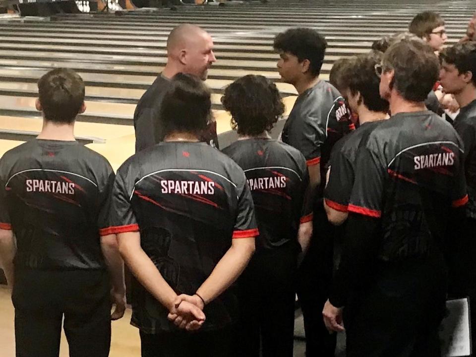 Pleasant boys bowling coach Bill Ludwig talks to his team between games at the Division II boys bowling state championship at Wayne Webb's Columbus Bowl.