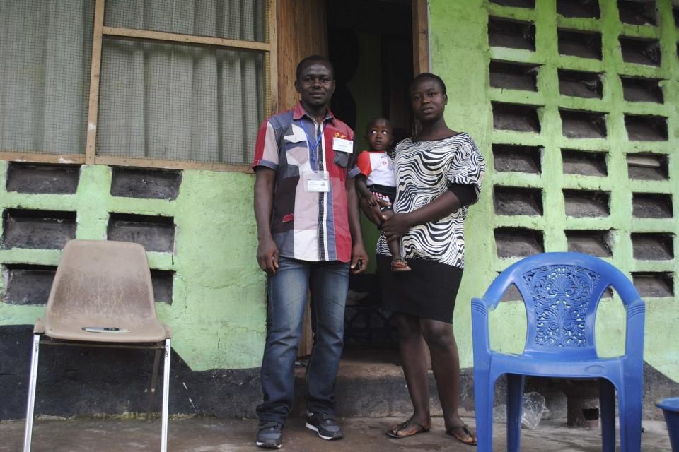 Marvin Kai, an Ebola survivor, poses for a picture with his wife Odell Kai and their one-year-old son in Monrovia, October 18, 2014. Kai was a healthcare worker with the World Health Organization (WHO) and was declared Ebola-free on August 20. REUTERS/James Giahyue (LIBERIA - Tags: DISASTER HEALTH)