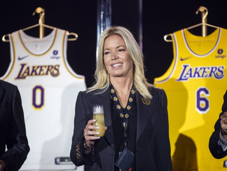 Lakers owner Jeanie Buss holds a new team jersey ahead of the 2021-2022 season