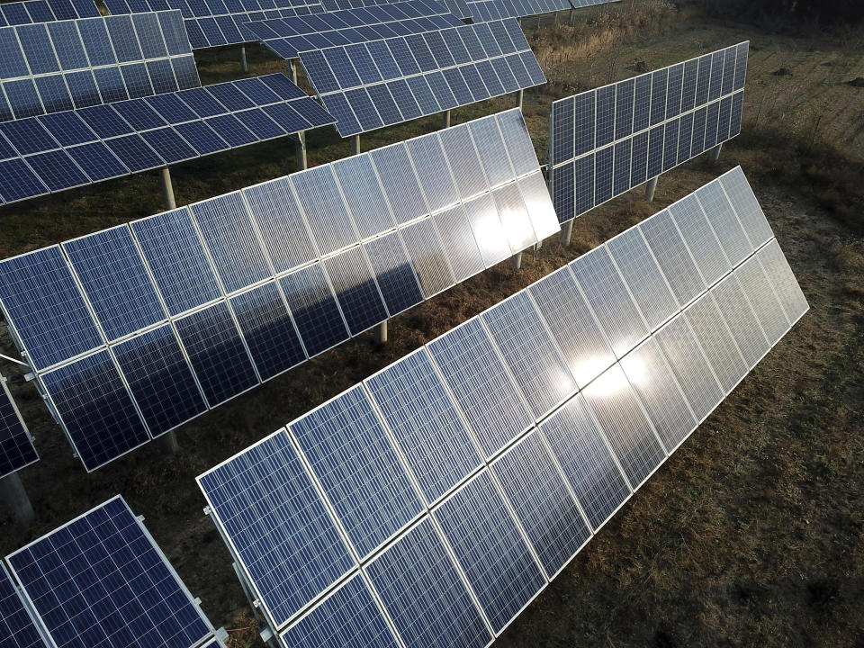 In this Nov. 28, 2019, photo, a solar panel installation is seen in Ruicheng County in central China's Shanxi Province. As world leaders gather in Madrid to discuss how to slow the warming of the planet, a spotlight is falling on China, the top emitter of greenhouse gases. China burns about half the coal used globally each year. Yet it's also the leading market for solar panels, wind turbines and electric vehicles. (AP Photo/Sam McNeil)