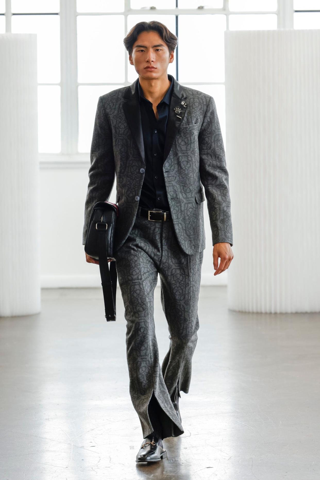Model Justin Lue wears SL Monogram Wool Suit, featured in Solomon Lawrence's collection during the 2024 Spring New York Fashion Week.