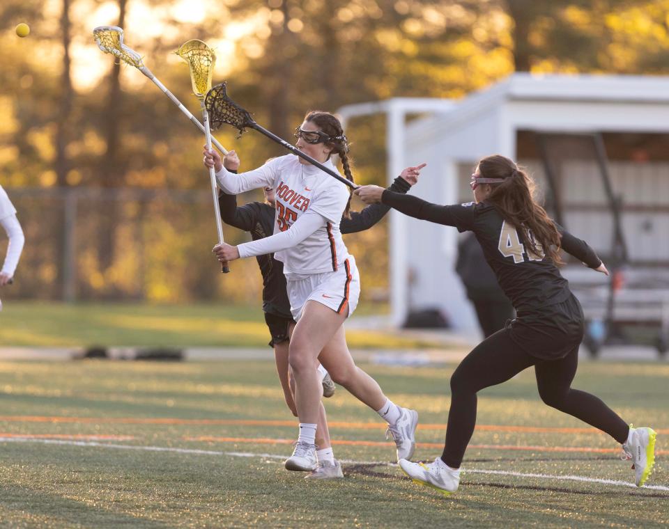 Hoover's Ava Streb shoots for a goal in the first half against Hathaway Brown at Hoover Thursday, April 25, 2024.