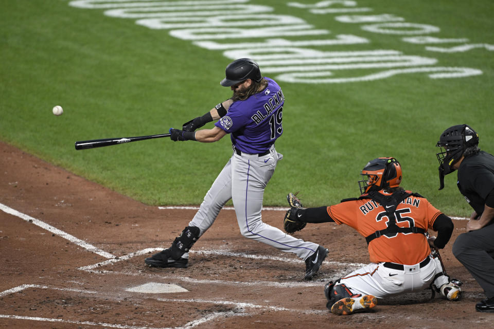 Colorado Rockies' Charlie Blackmon hits an RBI single against the Baltimore Orioles during the third inning of a baseball game Saturday, Aug. 26, 2023, in Baltimore. (AP Photo/Terrance Williams)