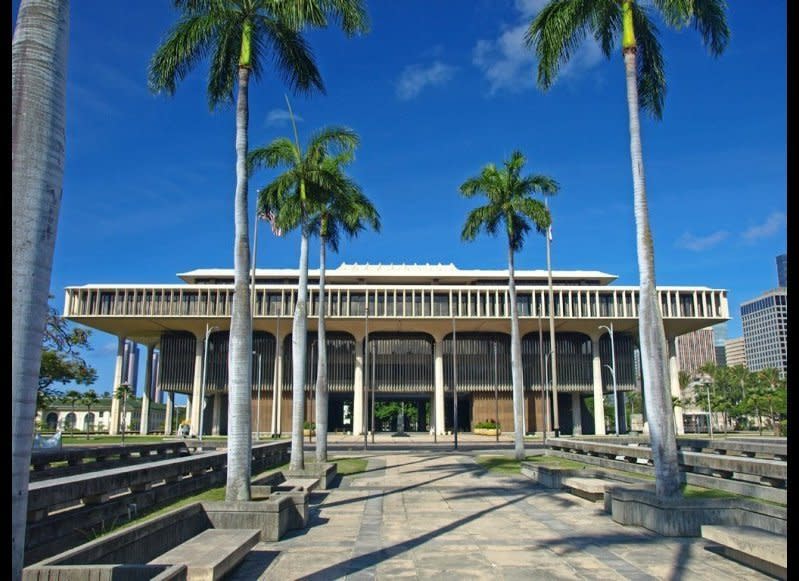 <strong>HAWAI'I STATE CAPITOL</strong>  Honolulu, Hawaii    <strong>Year completed:</strong> 1969  <strong>Architectural style:</strong> Hawaiian International  <strong>FYI:</strong> The eight columns in the front and back of the building are supposed to represent the eight islands of Hawaii, and the curved walls of the legislative houses recall the state’s volcanoes.  <strong>Visit:</strong> Scope out the capital on your own on weekdays from 9 a.m. to 2 p.m. (except for holidays), or arrange a guided tour through the Governor’s Office of Constituent Services.  