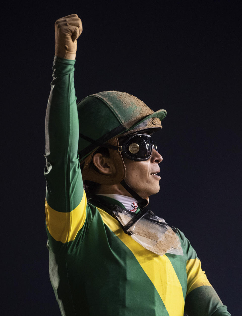 Ushba Tesoro's jockey Yuga Kawada reacts after winning the $12 million Group 1 Dubai World Cup over 2000m (10 furlongs) at the Meydan racecourse in Dubai, United Arab Emirates, Saturday, March 25, 2023. (AP Photo/Martin Dokoupil)