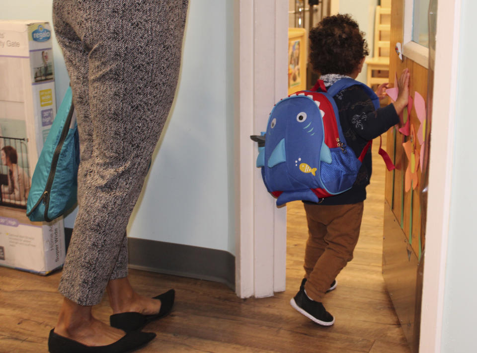 A young boy enters the toddler room with his mother at the KinderCare Child Development Center at The Venetian Resort Las Vegas April 18, 2024. (Jackie Valley/The Christian Science Monitor via AP)