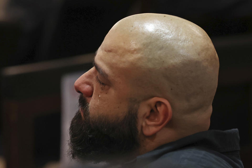 Family members react during the prosecution's closing argument in the capital murder trial of former U.S. Border Patrol supervisor Juan David Ortiz, at the Cadena-Reeves Justice Center in San Antonio, Texas, Wednesday, Dec. 7, 2022. (Jerry Lara/The San Antonio Express-News via AP)