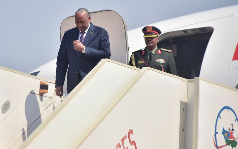 FILE PHOTO: Sudan's Sovereign Council Chief General Abdel Fattah al-Burhan disembarks from a plane as he arrives at the Juba International Airport, in Juba