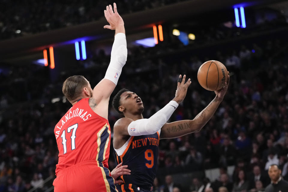 New York Knicks guard RJ Barrett (9) goes to the basket against New Orleans Pelicans center Jonas Valanciunas (17) during the first half of an NBA basketball game Saturday, Feb. 25, 2023, at Madison Square Garden in New York. (AP Photo/Mary Altaffer)