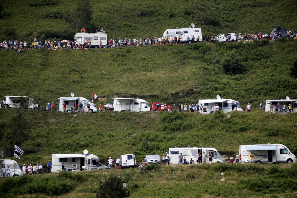 Camping cars of spectators are parked along the road of the Tourmalet pass during the fourteenth stage of the Tour de France cycling race over 117.5 kilometers (73 miles) with start in Tarbes and finish at the Tourmalet pass, France, Saturday, July 20, 2019. (AP Photo/ Christophe Ena)