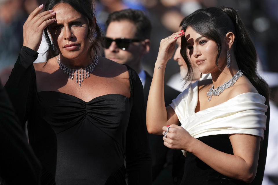 Karla Sofía Gascon,left, and Selena Gomez pose for photographers upon arrival at the premiere of the film 'Emilia Perez' at the 77th international film festival, Cannes, southern France, Saturday, May 18, 2024. (Photo by Scott A Garfitt/Invision/AP)