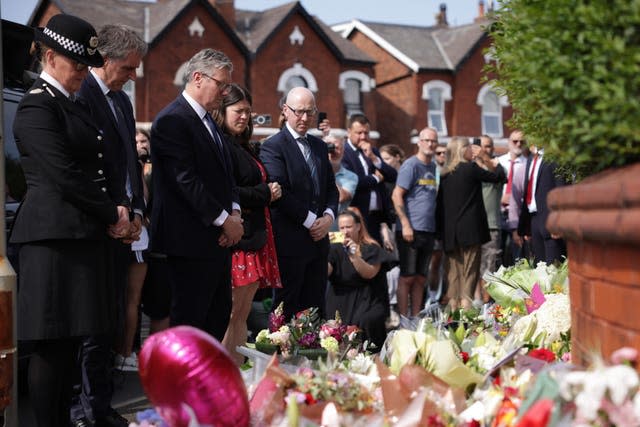 Sir Keir Starmer views floral tributes