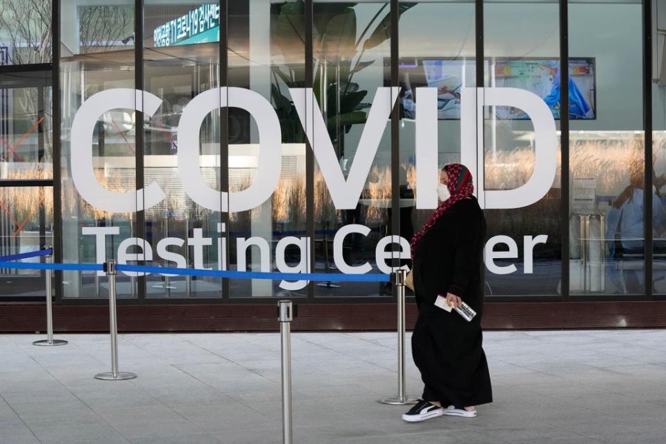 A traveler arrives to enter into a Covid-19 testing center at the Incheon International Airport In Incheon (Copyright 2021 The Associated Press. All rights reserved.)