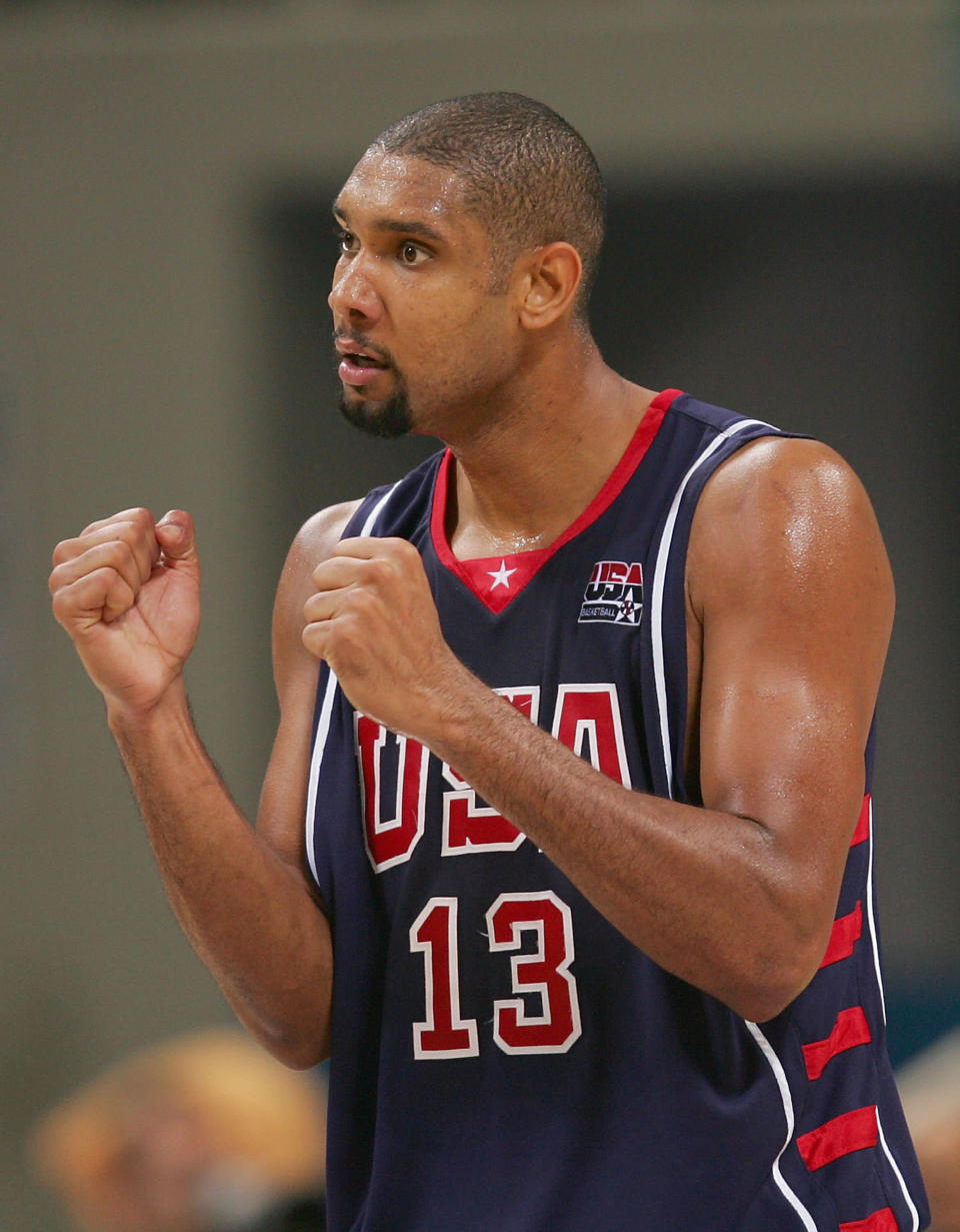 ATHENS - AUGUST 26: Tim Duncan #13 of United States celebrates defeating Spain in the men's basketball quarterfinal game on August 26, 2004 during the Athens 2004 Summer Olympic Games at the Indoor Hall of the Olympic Sports Complex in Athens, Greece. USA won 102-94 to advance to the semifinals. (Photo by Ezra Shaw/Getty Images)