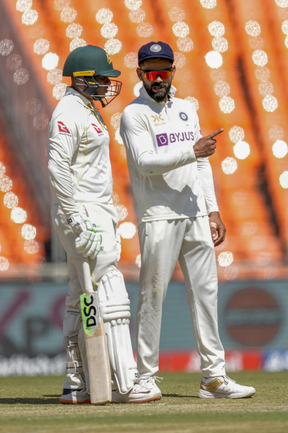 India's Virat Kohli, right, chat with Australia's Usman Khawaja during the second day of the fourth cricket test match between India and Australia in Ahmedabad, India, Friday, March 10, 2023. (AP Photo/Ajit Solanki)