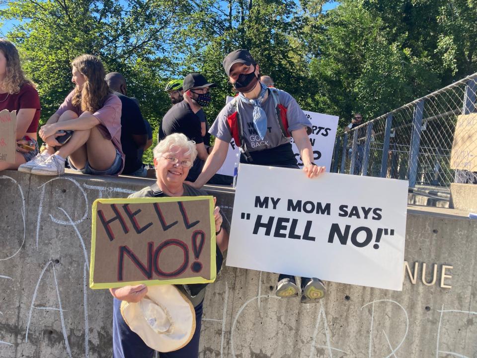 Heather Ivy, right, holds a sign that read “My mom says ‘Hell NO!’” and nearby her mother, Judy Ivy, indeed held a sign that read “HELL NO" on Friday, June 24, 2002 in Eugene, Ore.