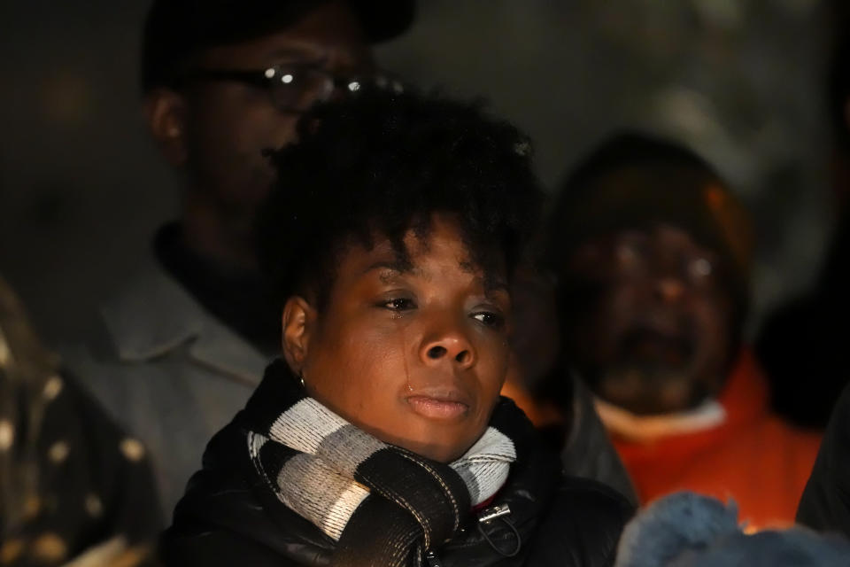 A woman cries during a candlelight vigil for Tyre Nichols, who died after being beaten by Memphis police officers, in Memphis, Tenn., Thursday, Jan. 26, 2023. (AP Photo/Gerald Herbert)