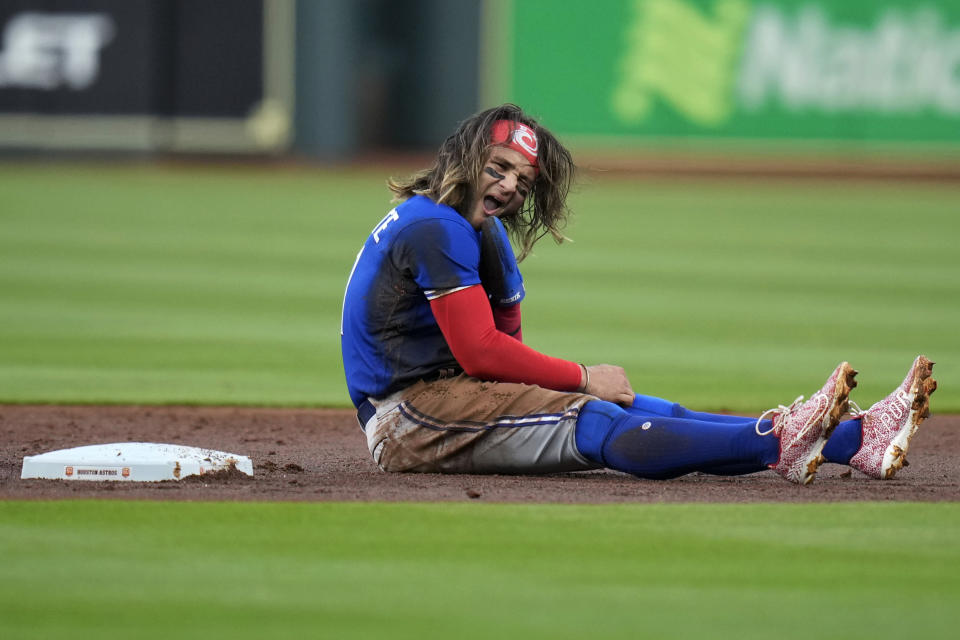 Toronto Blue Jays' Bo Bichette reacts after being tagged out by Houston Astros second baseman Aledmys Diaz while attempting to steal second during the first inning of a baseball game Friday, April 22, 2022, in Houston. (AP Photo/Eric Christian Smith)