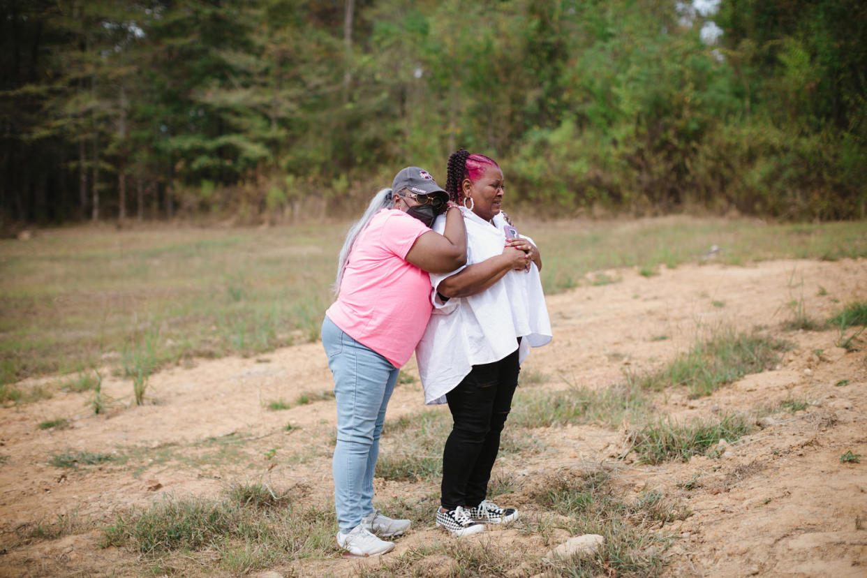 Image: Bettersten Wade is comforted by her sister. (Ashleigh Coleman for NBC News)