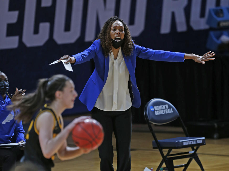 Kentucky head coach Kyra Elza gives instruction to her team during the second half of a college basketball game in the second round of the women's NCAA tournament at the Greehey Arena in San Antonio, Texas, Tuesday, March 23, 2021. Iowa defeated Kentucky 86-72. (AP Photo/Ronald Cortes)