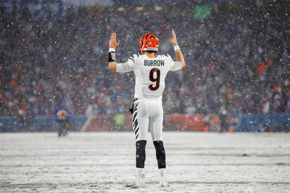 Cincinnati Bengals quarterback Joe Burrow signals for a touchdown during an AFC divisional playoff game Sunday, Jan. 22, 2023, in Orchard Park, NY.
