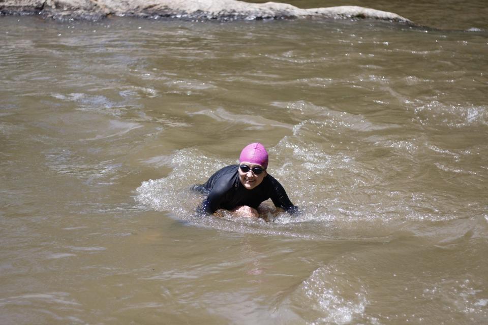 Laura Carney swimming the French Broad River.