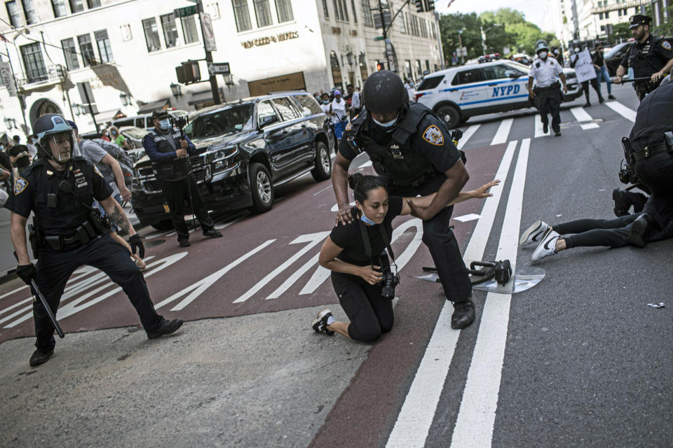 Police detain protesters in front of Trump Tower during a solidarity rally for George Floyd, Saturday, May 30, 2020, in New York. Demonstrators took to the streets of New York City to protest the death of Floyd, a black man who was killed in police custody in Minneapolis on May 25. (AP Photo/Wong Maye-E)