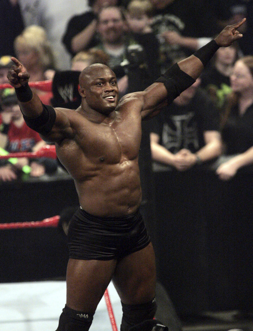 FILE - WWE wrestler Bobby Lashley celebrates after defeating Chris Masters during a match in Indianapolis, in this Monday, March 19, 2007, file photo. Fifty-four 54-year-old Bill Goldberg returns for his second match of the year when he challenges Lashley for the WWE title Saturday night, Aug. 21, 2021, at SummerSlam at Allegiant Stadium. (AP Photo/Tom Strattman, File)