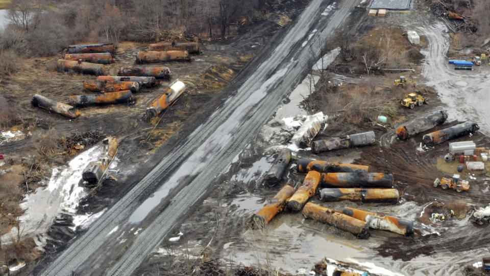 This photo taken with a drone shows the continuing cleanup of portions of a Norfolk Southern freight train that derailed Friday night in East Palestine, Ohio, Thursday, Feb. 9, 2023. (AP Photo/Gene J. Puskar)