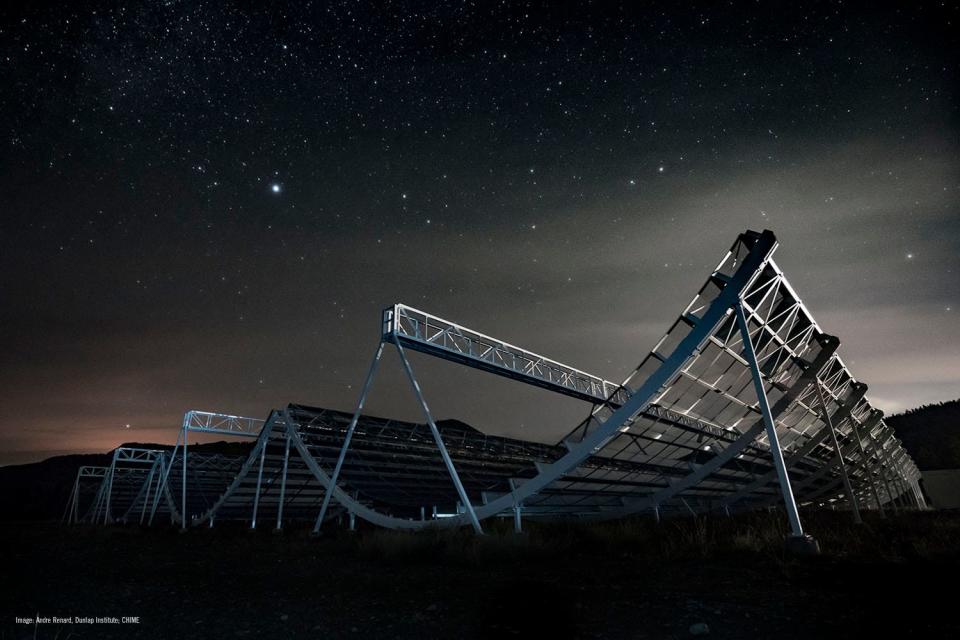 The CHIME telescope at night in British Columbia. The telescope will help detect future fast radio bursts.