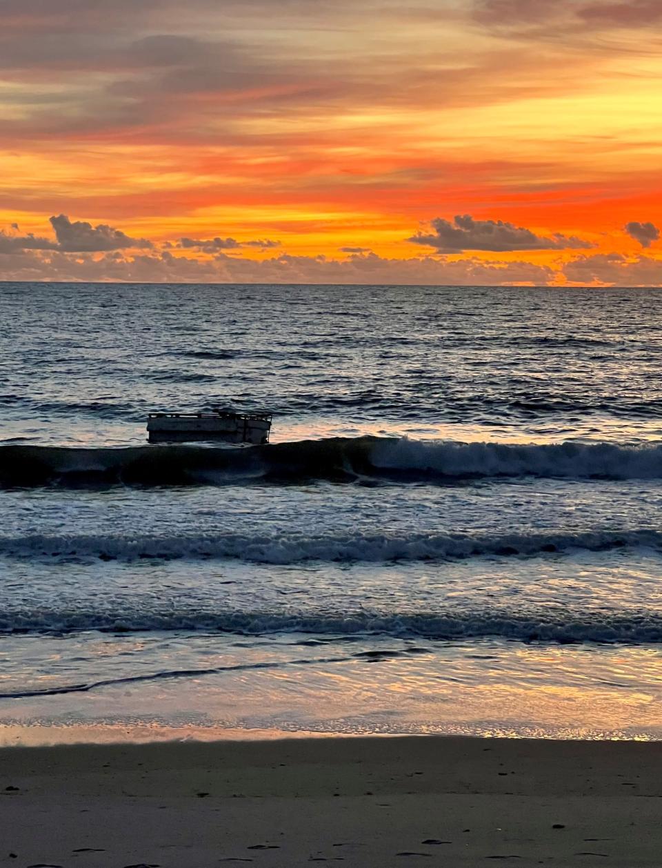 Satellite Beach resident Keri Owen photographed the foam-hulled vessel floating in the surf zone Tuesday morning north of Pelican Beach Park.