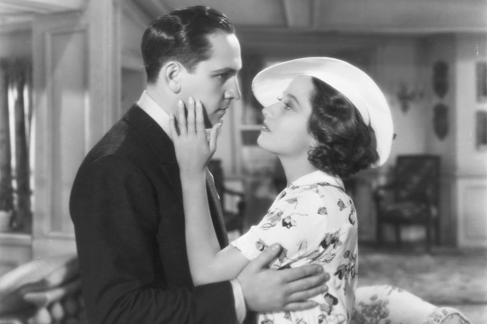 Alan Trent (Fredric March) and Kitty Vane (Merle Oberon) embracing in The Dark Angel. (Photo by �� John Springer Collection/CORBIS/Corbis via Getty Images)