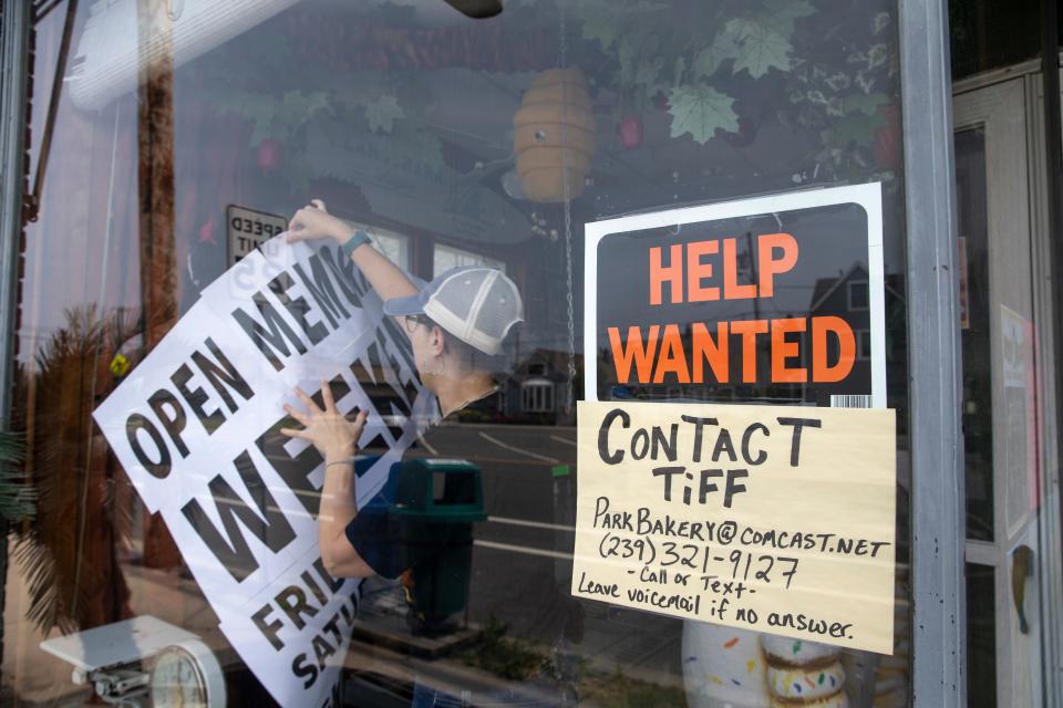 Tiffany Hulse, manager of Park Bakery, hangs an open sign in the window next to a help wanted sign.  The summer tourism season kicks off this weekend, and Shore businesses are hoping to improve on last year, when Monmouth and Ocean County visitors generated $8.2 billion. Small business owners along the boardwalk prepare for the holiday weekend.  
Seaside Park, NJ
Tuesday May 23, 2023