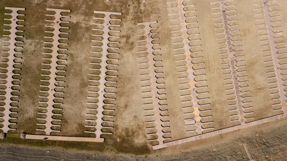 FILE – Boat docks sit on dry land at the Browns Ravine Cove area of drought-stricken Folsom Lake, in Folsom, Calif., on May 22, 2021. Months of winter storms have replenished California’s key reservoirs after three years of punishing drought. (AP Photo/Josh Edelson, File)