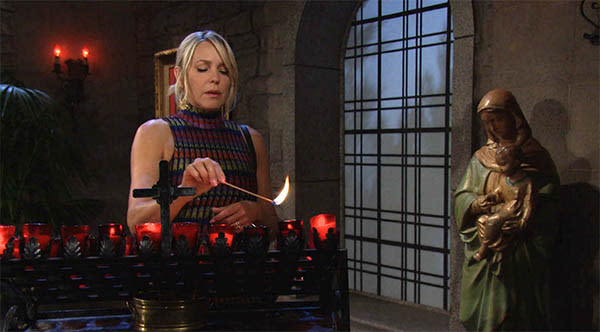 Nicole went to the chapel and lit a candle before saying a prayer.