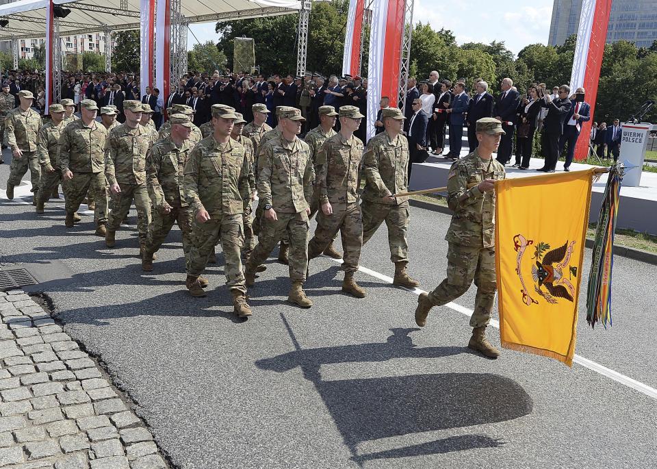 U.S military takes party during the annual Armed Forces review during a national holiday, in Katowice, Poland, Thursday, Aug. 15, 2019. Large crowds turned out for the celebration which this year included a fly-over by two U.S. F-15 fighter jets. (AP Photo/Czarek Sokolowski)