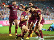 Queensland surround Cronk after scoring.