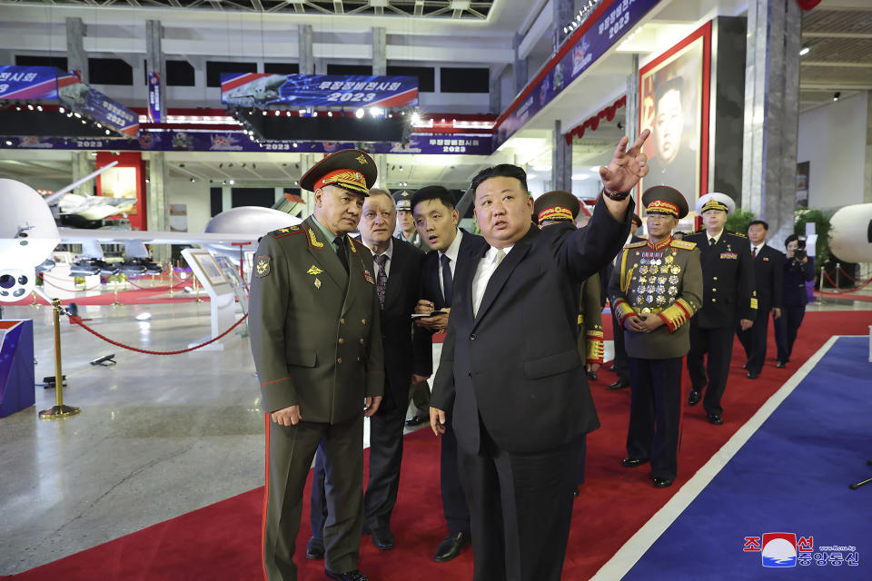 In this photo provided by the North Korean government, North Korean leader Kim Jong Un, front right, and Russian Defense Minister Sergei Shoigu, front left, visit an arms exhibition in Pyongyang, North Korea Wednesday, July 26, 2023. Independent journalists were not given access to cover the event depicted in this image distributed by the North Korean government. The content of this image is as provided and cannot be independently verified. Korean language watermark on image as provided by source reads: "KCNA" which is the abbreviation for Korean Central News Agency. (Korean Central News Agency/Korea News Service via AP)