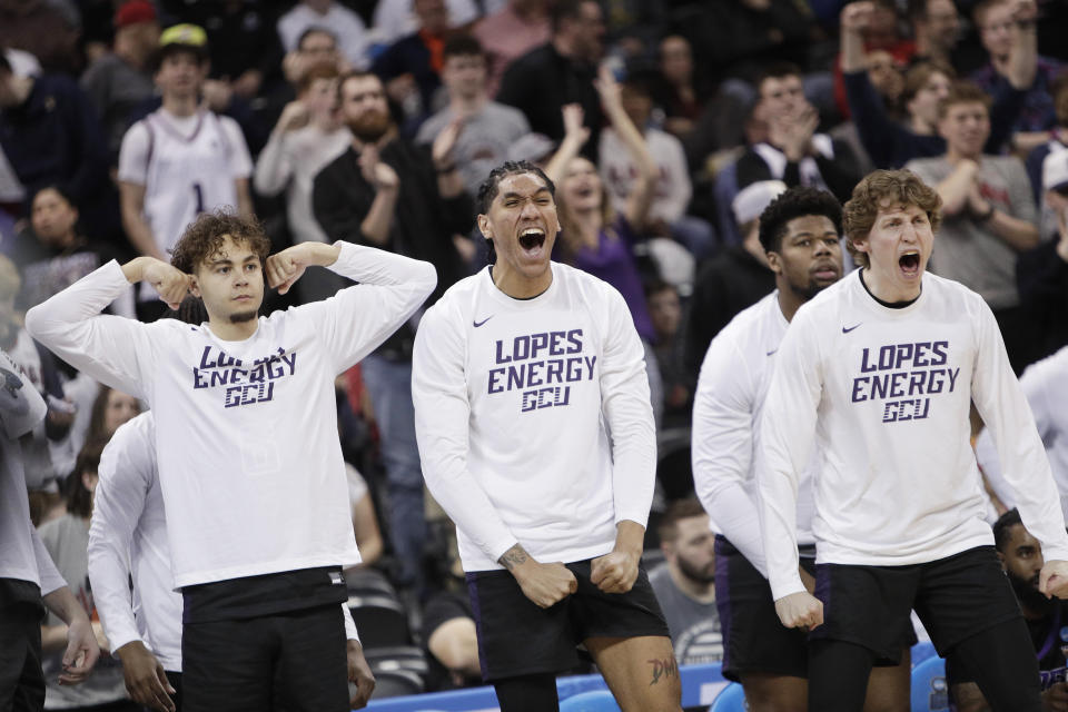 Grand Canyon players on the bench react during the second half of the team's first-round college basketball game against Saint Mary's in the men's NCAA Tournament in Spokane, Wash., Friday, March 22, 2024. (AP Photo/Young Kwak)