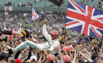 Mercedes driver Lewis Hamilton of Britain celebrates after winning the British Formula One Grand Prix at the Silverstone racetrack, Silverstone, England, Sunday, July 14, 2019. (AP Photo/Luca Bruno)