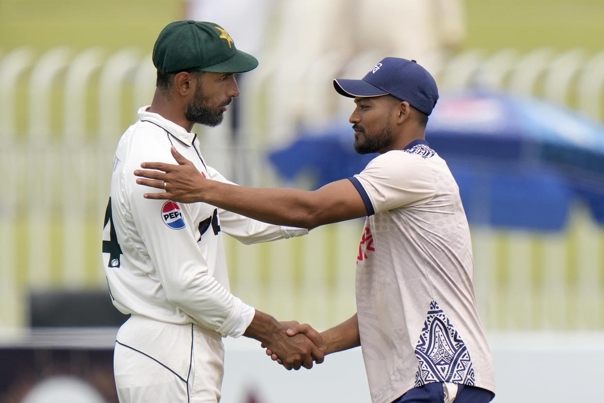 Bangladesh's Najmul Hossain Shanto, right, shakes hand with Pakistan's Shan Masood after winning the second test cricket match against Pakistan, in Rawalpindi, Pakistan, Tuesday, Sept. 3, 2024. (AP Photo/Anjum Naveed)