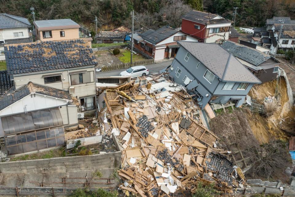 This aerial photo shows damaged and destroyed homes along a street in Wajima, Ishikawa prefecture (AFP via Getty Images)