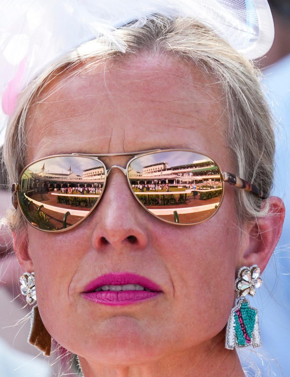 Churchill Downs' renovated paddock is reflected in the sunglasses of a Thurby guest May 2, 2024 at Churchill Downs in Louisville, Kentucky.