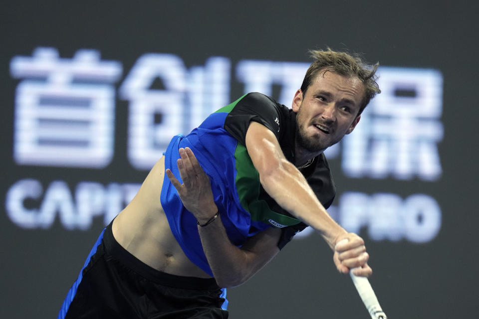 Daniil Medvedev of Russia serves to win against Alexander Zverev of Germany during the men's singles semifinal match in the China Open tennis tournament at the Diamond Court in Beijing, Tuesday, Oct. 3, 2023. (AP Photo/Andy Wong)