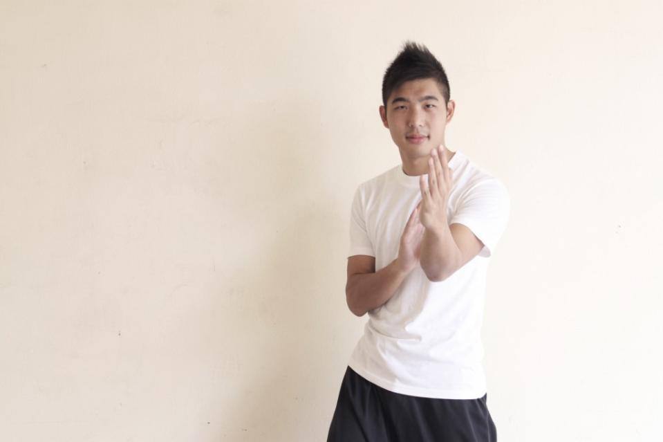 Instructor Daryl Yeo strikes the Mun Sau pose. (Image Credit: Emily Mok)