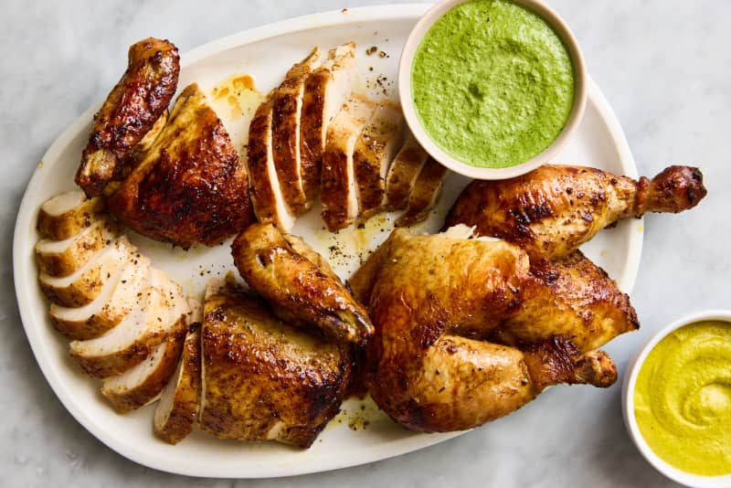 chicken in quarters on platter with breasts sliced