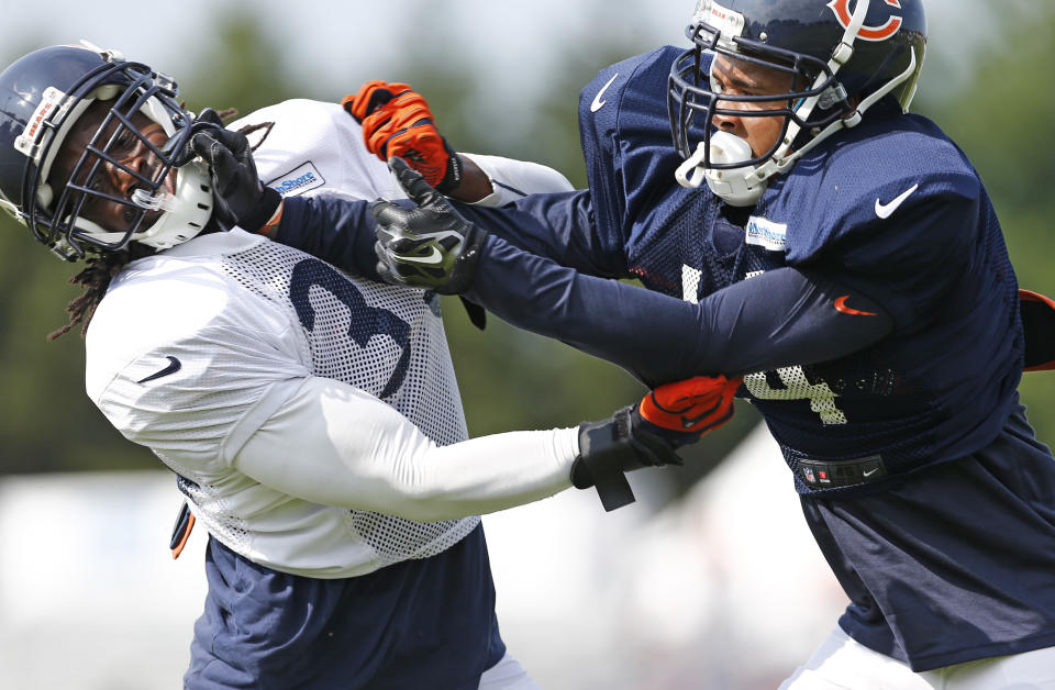 Chicago Bears wide receiver Eric Weems (14), right, works with cornerback Charles Tillman (33) during NFL football training camp at Olivet Nazarene University, Wednesday, July 30, 2014, in Bourbonnais, Ill. (AP Photo/Nam Y. Huh)