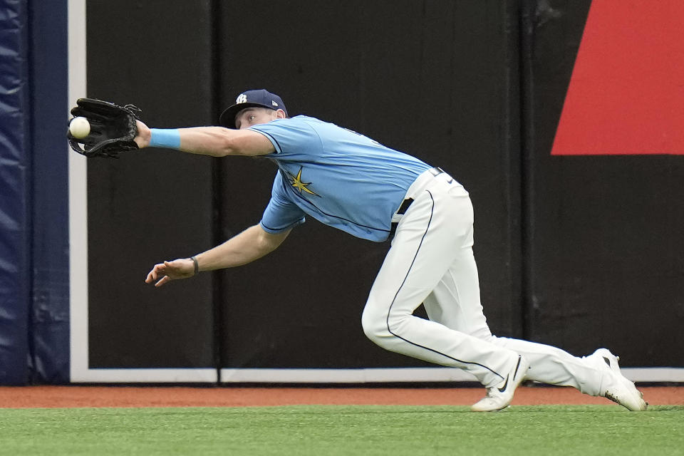 Tampa Bay Rays left fielder Luke Raley makes a diving catch on a fly out by Los Angeles Dodgers' Freddie Freeman during the first inning of a baseball game Sunday, May 28, 2023, in St. Petersburg, Fla. (AP Photo/Chris O'Meara)